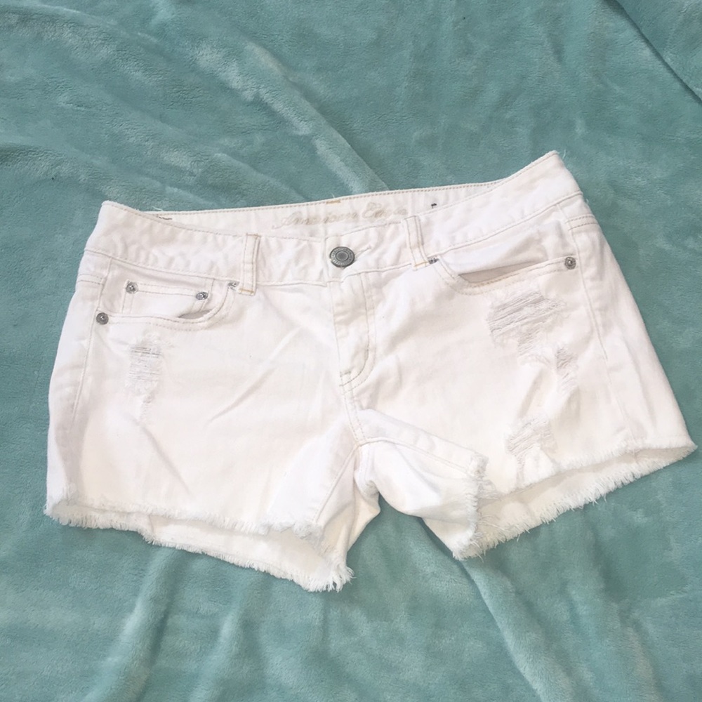 White distressed shorts.